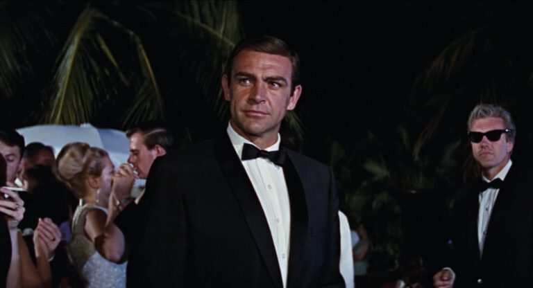 James Bond in a black dinner suit.